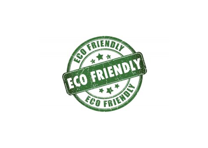 The image shows a circular stamp-like graphic with text around its perimeter reading ECO FRIENDLY at the top, STAMP in the center, and ECO FRIENDLY again at the bottom, all within a border that appears to be made of a green substance or paint. The background is white.